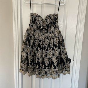 Black and gold embroidered mini cocktail dress